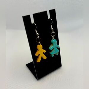 Handmade turquoise and yellow female and male meeple earrings.